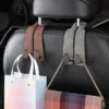 my-11134207-7rasf-mcg0g8tv67zhca.webp Random MOTUS Suede Car Headrest Double Hook